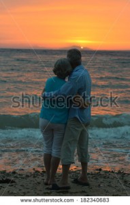 stock-photo-elderly-couple-in-love-at-sunset-on-a-summer-evening-watching-sea-182340683
